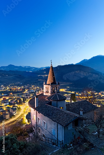 The church of Montalbano and the town of Mori. In the background the Brentonico plateau and the Mount Baldo. Vallagarina, Trento province, Trentino Alto-Adige, Italy, Europe. photo