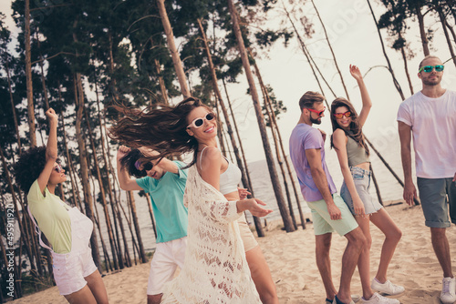 Photo of positive dancer party best friends enjoy beach event wear sunglass casual clothes nature summer seaside beach
