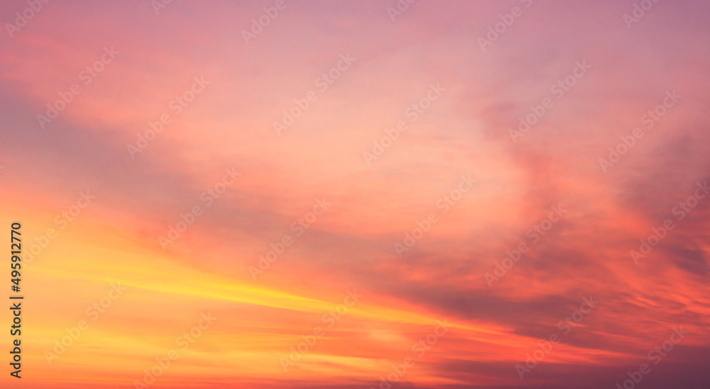 sunset sky background with romantic orange sunlight cloud 