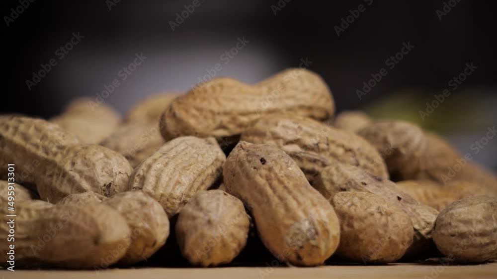 Raw peanuts. Rotation. One open nut. Raw peanuts. Rotation. One open nut.