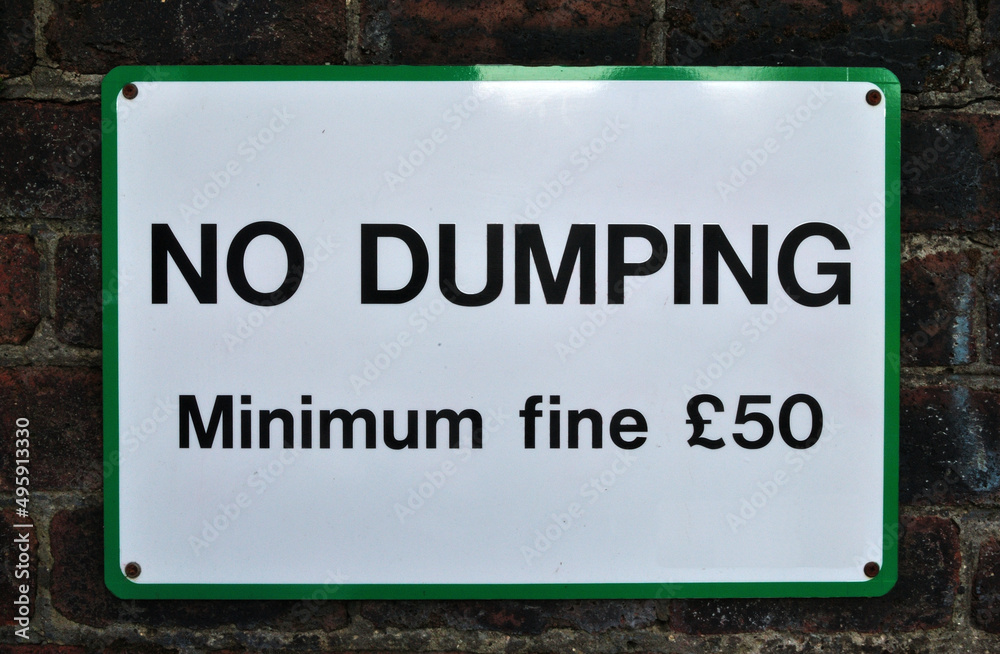 Close Up of Sign 'No Dumping-minimum Fine £50' Close Up of Sign 'No Dumping-minimum Fine £50'