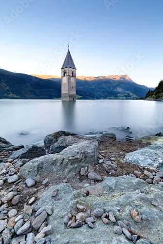 The Curon bell tower emerges from the Resia lake. Venosta Valley, Bolzano province, Trentino Alto-Adige, Italy, Europe.