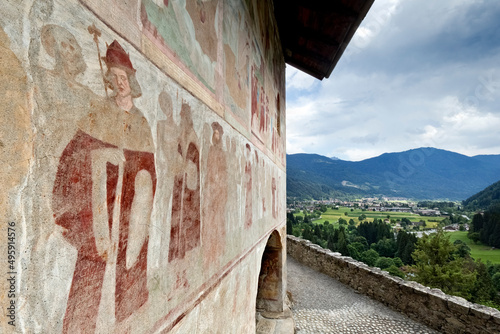 The medieval Santo Stefano church stands on a rocky spur at the entrance of the Genova Valley. Carisolo, Trento province, Trentino Alto-Adige, Italy, Europe. photo