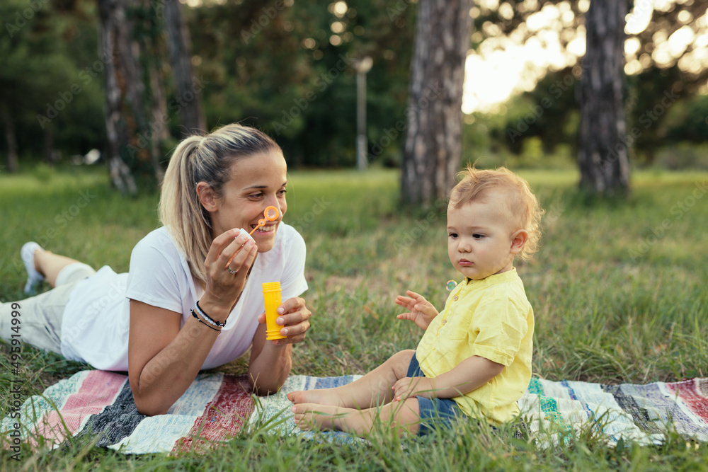 mother and her son playing together outdoor mother and her son playing together outdoor