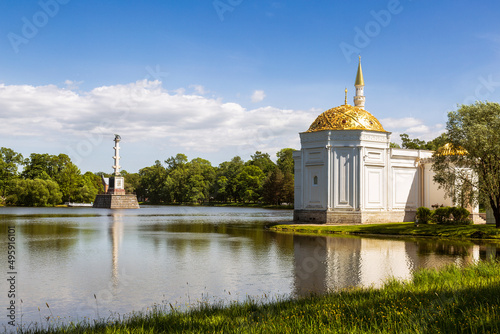 View of a Large pond with a Turkish bath building and a Chesma column on its shore. Catherine park in Tsarskoye Selo. Pushkin town, Saint Petersburg, Russia photo