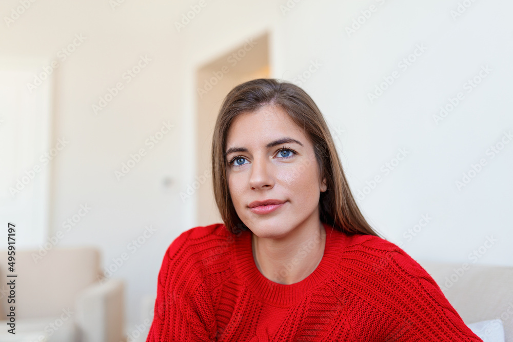 Portrait of a beautiful woman smiling at home. woman in casual looking at camera with copy space. Cheerful woman relaxing at home with smile. Portrait of a beautiful woman smiling at home. woman in casual looking at camera with copy space. Cheerful woman relaxing at home with smile.