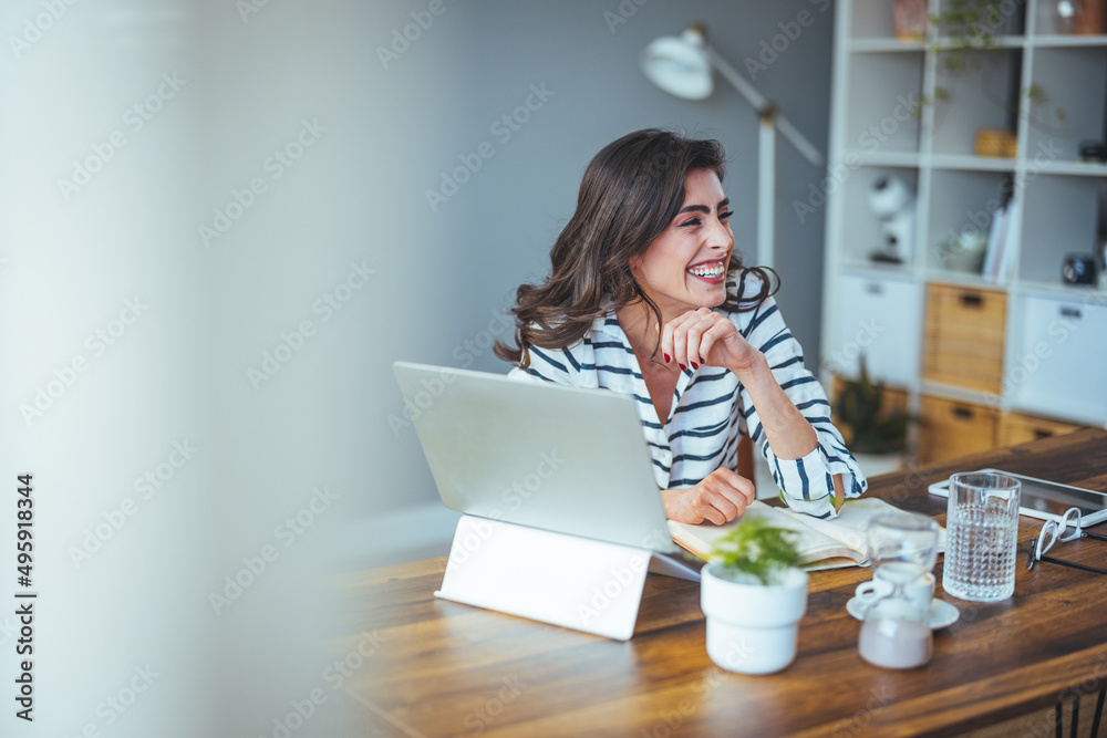 A beautiful business woman in casual clothes works on a virtual computer in the office desk. Small business owner people employed free online we are marketing e-commerce telemarketing 