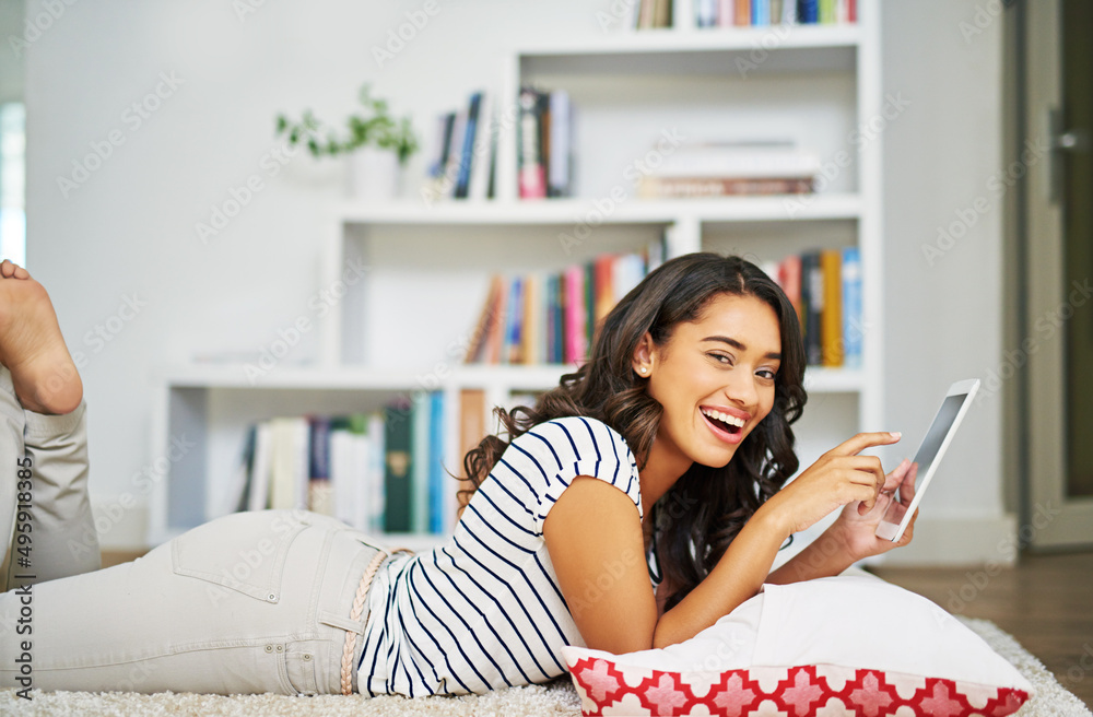 Youve gotta check out this blog. Cropped portrait of a young woman using her tablet while relaxing at home. Youve gotta check out this blog. Cropped portrait of a young woman using her tablet while relaxing at home.