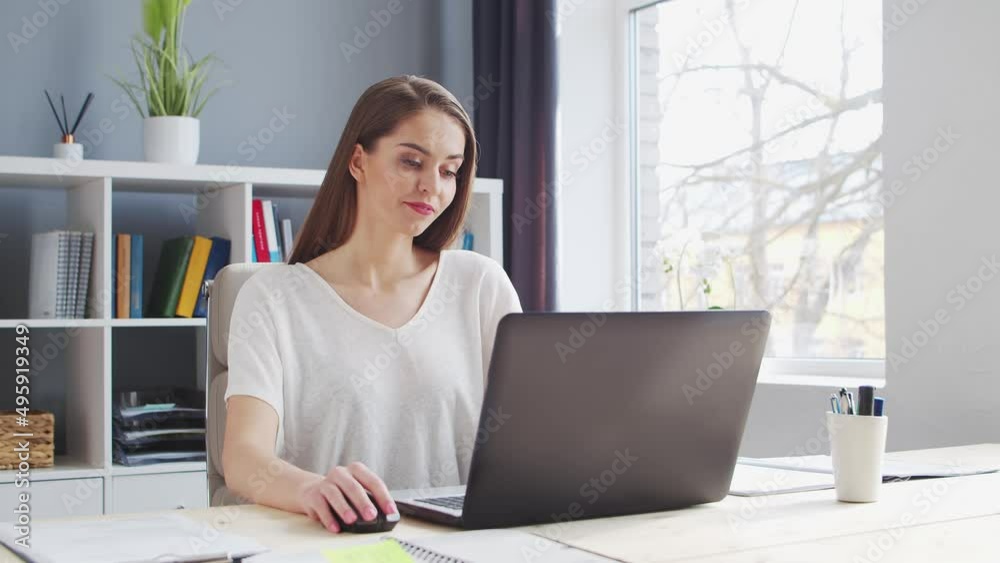 Young Woman Works at Home Office Using Computer. Workplace of Female Entrepreneur, Freelancer or Student. Remote Work and Education Concept. Young Woman Works at Home Office Using Computer. Workplace of Female Entrepreneur, Freelancer or Student. Remote Work and Education Concept.