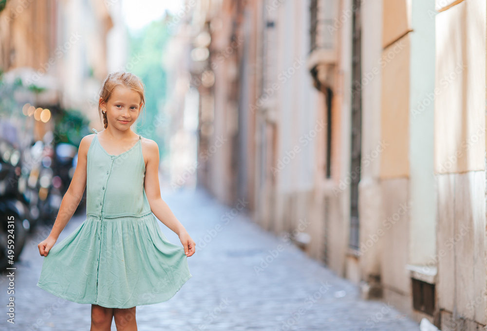 Adorable fashion little girl outdoors in European city Rome