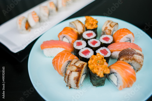 a set of sushi rolls from fish and seafood a set of different videos japanese cuisine delivery