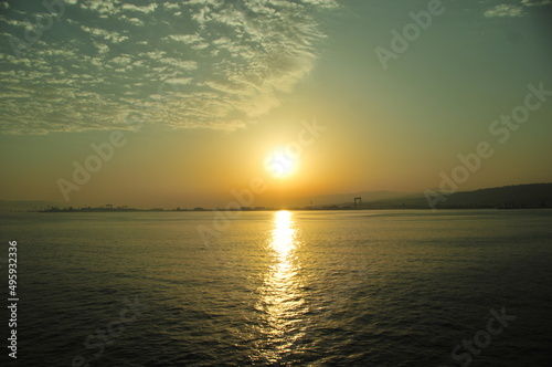 sunset over sea with sun reflection and cloud sky, sunset sea reflection sun horizon