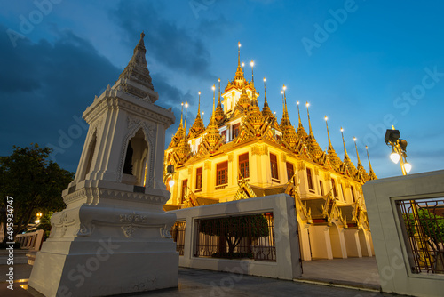 Wat Ratchanatdaram and Loha Prasat Metal Castle at twilight, landmark and famous place of Bangkok, Thailand photo