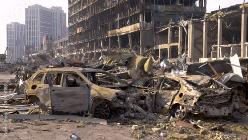 Russia war damage building destruction city war ruins city damage car. Terror attack bomb shell of civilian bombed. Disaster area. 2022 Russian invasion of Ukraine war torn city destroyed car burn out