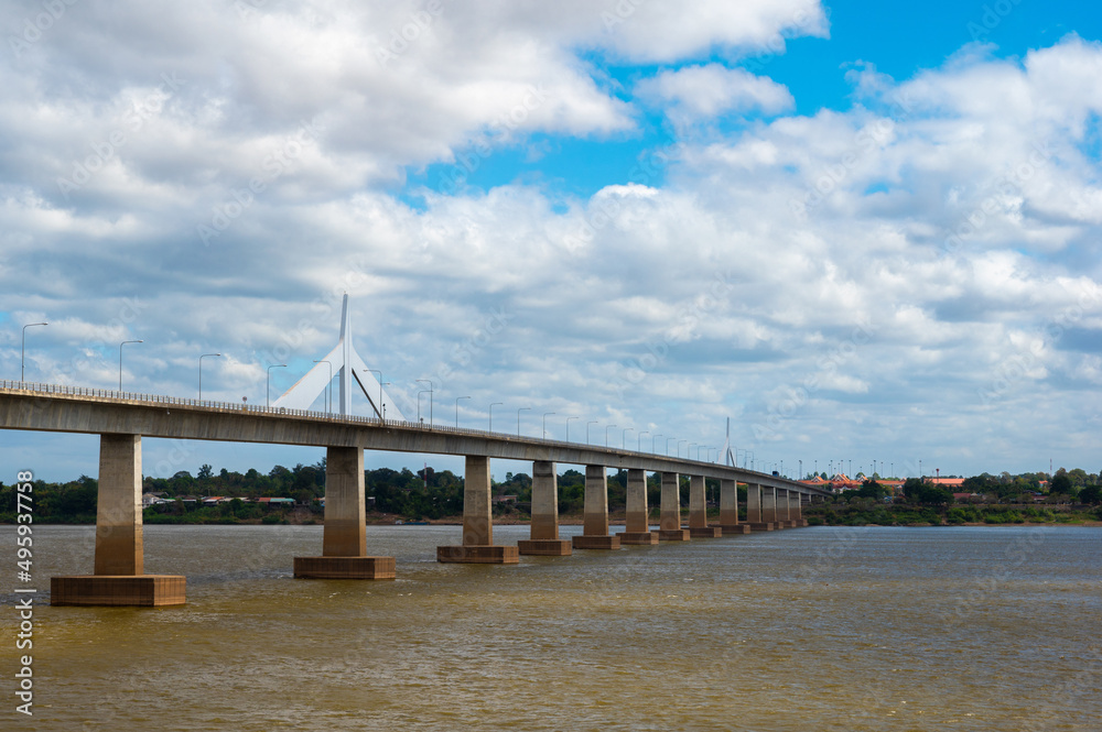 Landscape of Mukdahan Thai-Laos Friendship Bridge II viewpoint at Mekong river in cloudy blue sky background at Mukdahan province, Thailand. Landscape of Mukdahan Thai-Laos Friendship Bridge II viewpoint at Mekong river in cloudy blue sky background at Mukdahan province, Thailand.