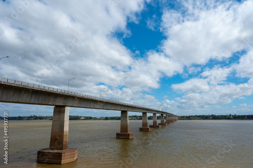 Wallpaper Mural Landscape of Mukdahan Thai-Laos Friendship Bridge II viewpoint at Mekong river in cloudy blue sky background at Mukdahan province, Thailand. Torontodigital.ca