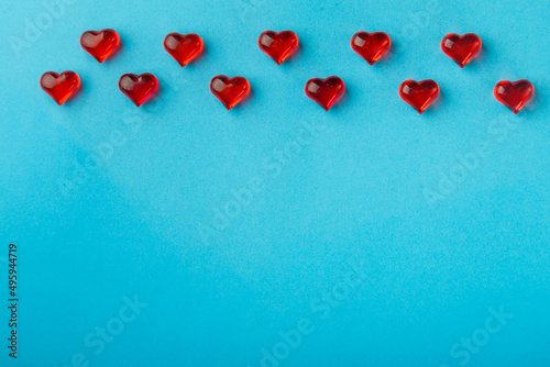 Frame for Valentine's day hearts on a blue background.