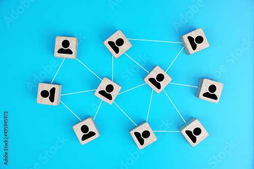 Wooden blocks connected together social network  on blue background. Teamwork, network and community concept.                     