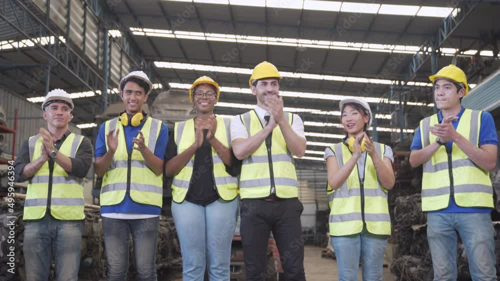 Foreman and factory workers applauding. Multicultural multinational team cheering in Manufacture. team applauding success and cheer victory in automotive parts warehouse.
