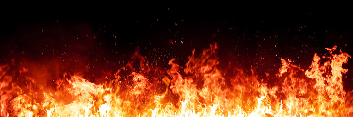 Burning red hot sparks rise from large fire in the night. Fire flames sparks background. Abstract dark glitter fire particles lights.