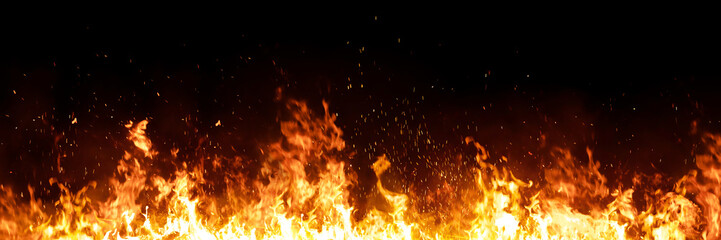 Burning red hot sparks rise from large fire in the night. Fire flames sparks background. Abstract dark glitter fire particles lights.