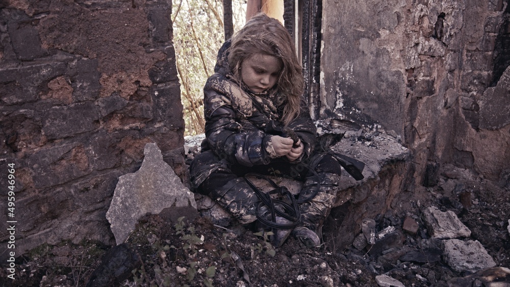 girl praying. Children without a home, apocalypse, war