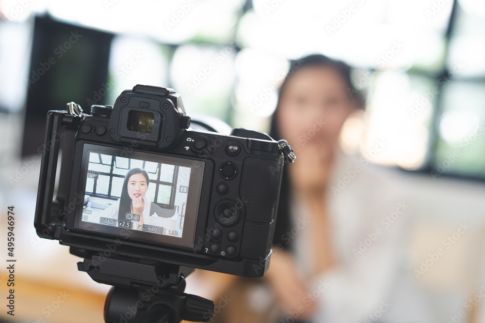 asian teenage talk to camera recording footage for social media clip