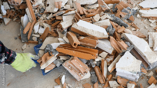 Pile of construction waste after wall demolition in an apartment during remodeling