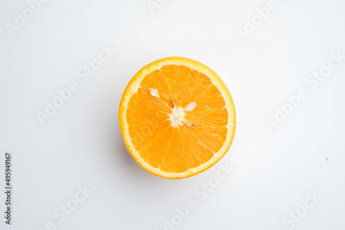 Half of an orange on a white background.