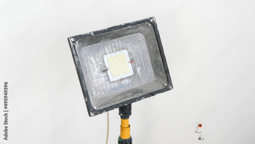 Big led lamp standing on construction site, isolated Big led lamp standing on construction site, isolated