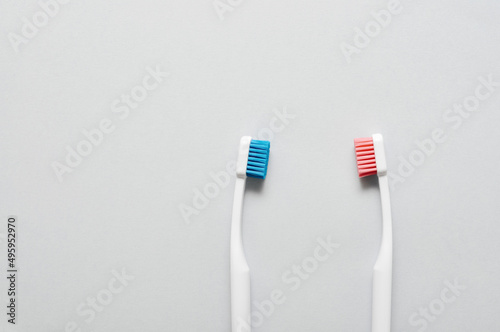 Toothbrushes on light background  top view