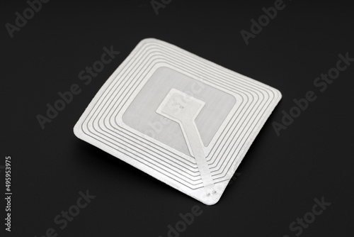 RFID tag isolated on black background. Radio frequency identification photo