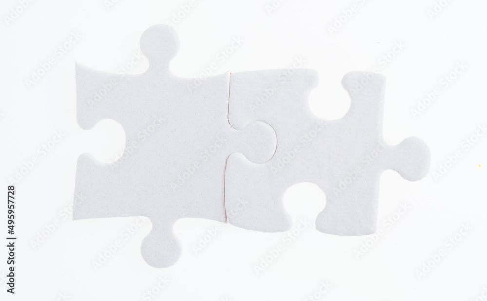 Two puzzle pieces on white background Two puzzle pieces on white background