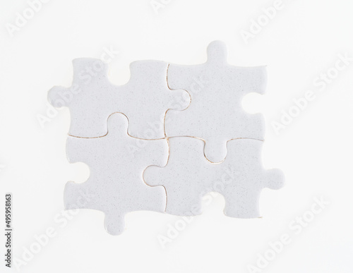 Four puzzle pieces on white background