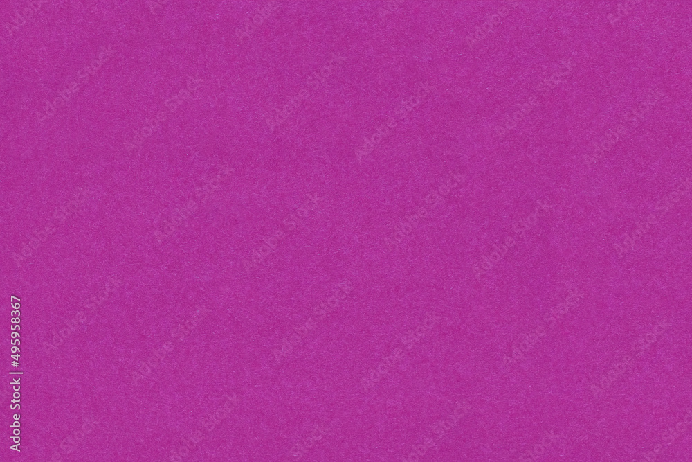 Paper background in monochromatic lilac color with a fibrous texture. Paper background in lilac color with empty space for text or advertisement. Uniform paper texture for packaging or background