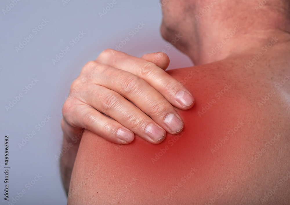 Shoulder pain close up. Abstarct man suffering from ache in body. Red point. High quality photo Shoulder pain close up. Abstarct man suffering from ache in body. Red point. High quality photo