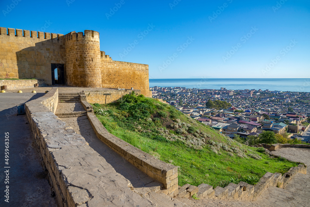 A fragment of the Derbent fortress in the urban landscape. Republic of Dagestan, Russia