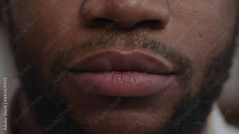 Extreme close-up of a man's lips in silence Extreme close-up of a man's lips in silence