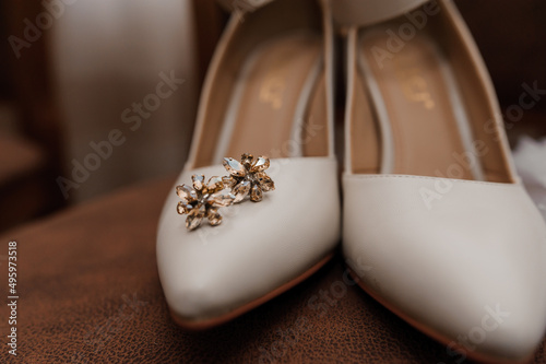 Wedding accessories: wedding shoes, earrings with natural yellow stones