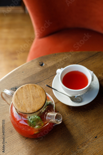 teapot with tea on a wooden table in a premium restaurant 