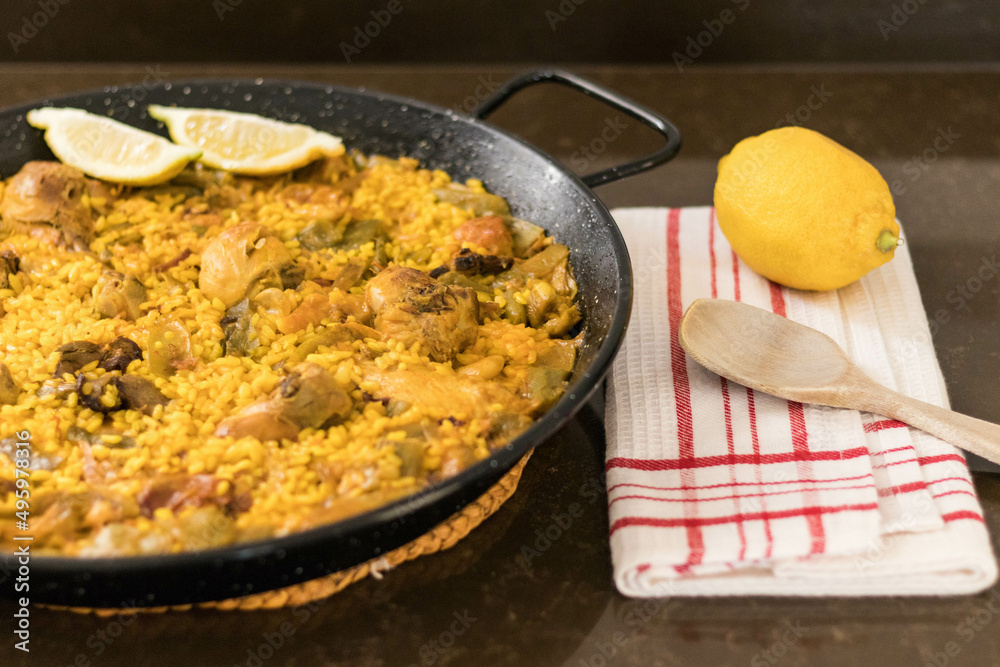 valencian paella with chicken and rabbit ready to serve valencian paella with chicken and rabbit ready to serve