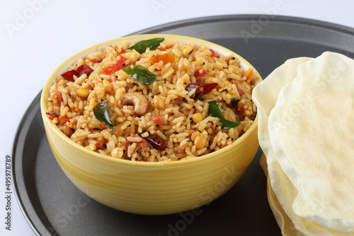 Tomato rice.spicy South Indian rice recipe Tomato pulao or Tomato Rice ,South Indian Thakkali Sadam ,Tomato Bath an Indian vegetarian dish. Healthy nutritious photo