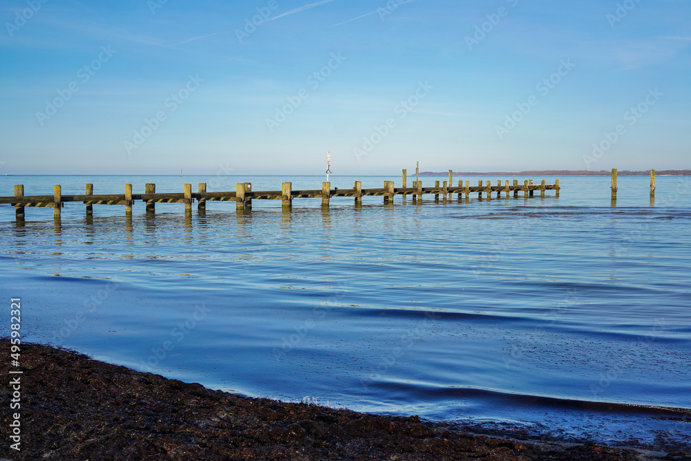 Old wooden pier in the Baltic sea in Travemünde