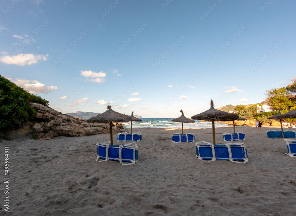 Beach with white sand and turquoise water of the Mediterranean sea in Alcudia, Mallorca, or Majorca, Balearic Islands, Spain