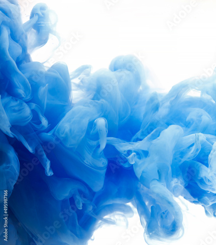 Blue clouds of ink in liquid isolated on white