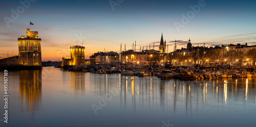 Panoramic view of the old harbor of La Rochelle at sunset. beautiful city lights