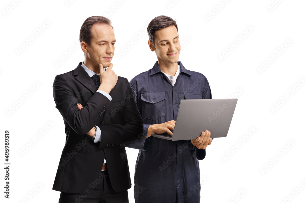 Businessman and a worker in a uniform looking at a digital tablet Businessman and a worker in a uniform looking at a digital tablet