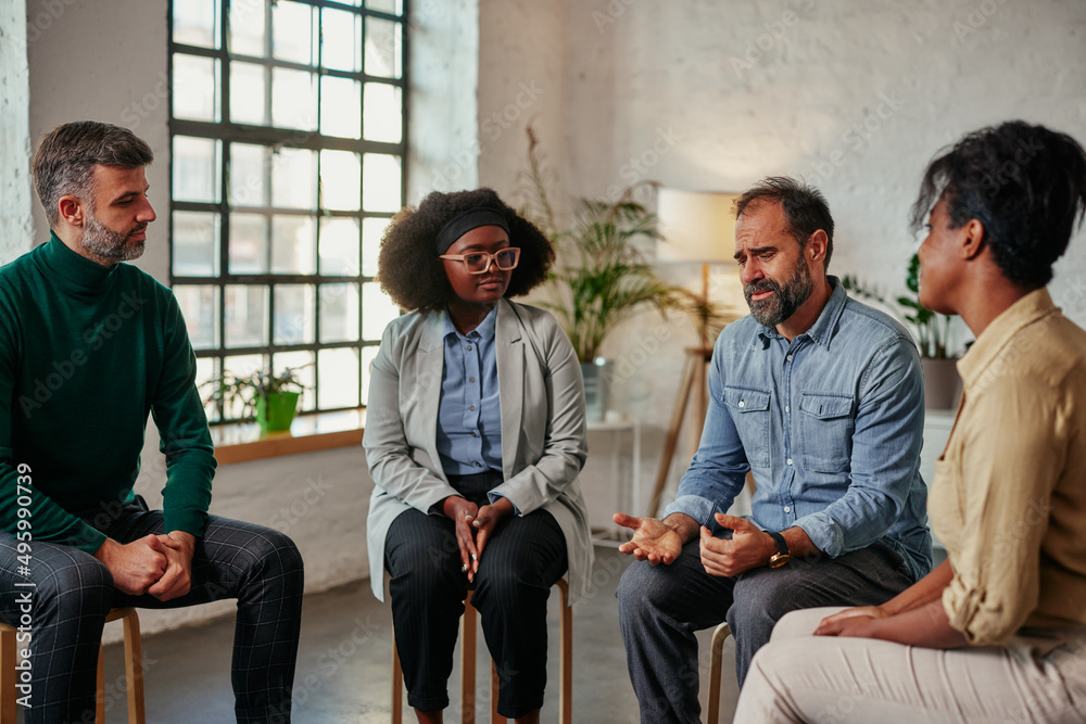 Multiracial people in group therapy session Multiracial people in group therapy session