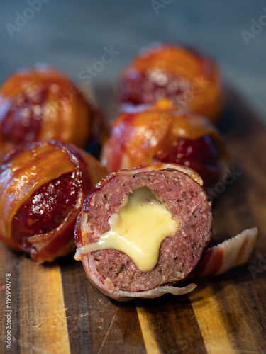 Meatballs filled with cheddar cheese and wrapped with bacon known as moinkballs photo