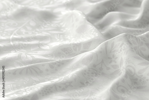 White fabric with a reflective floral pattern